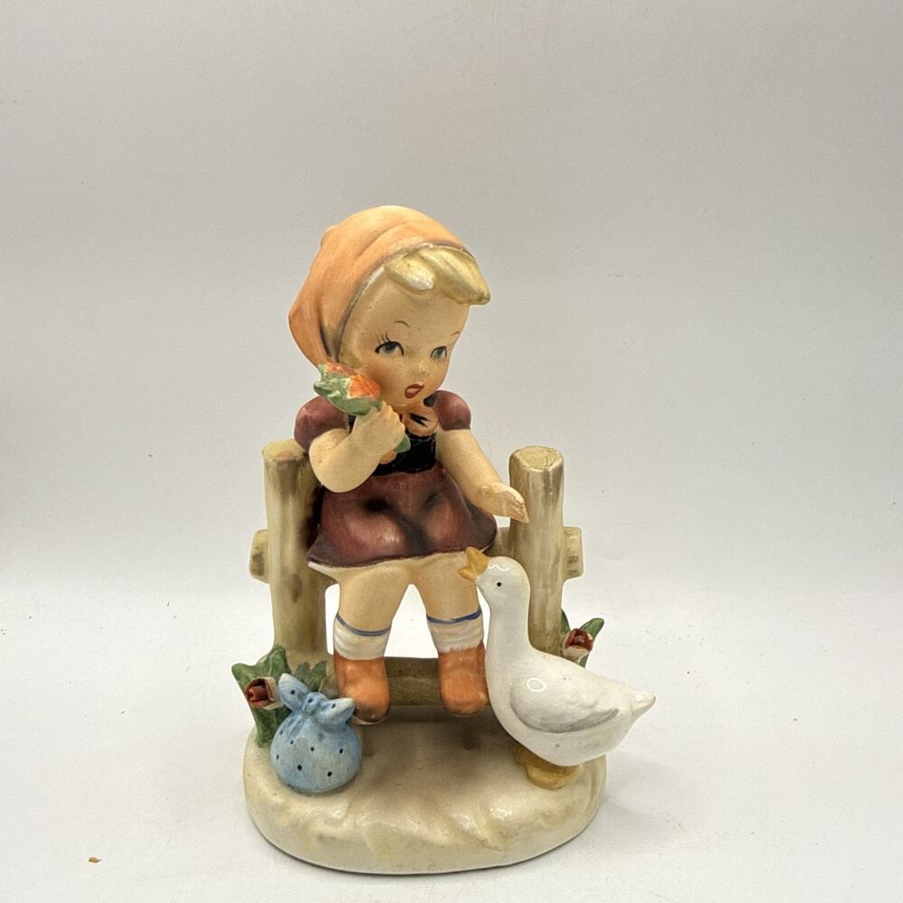 VINTAGE CERAMIC FIGURINE OF GIRL ON FENCE WITH DUCK / GOOSE .... #8026 *